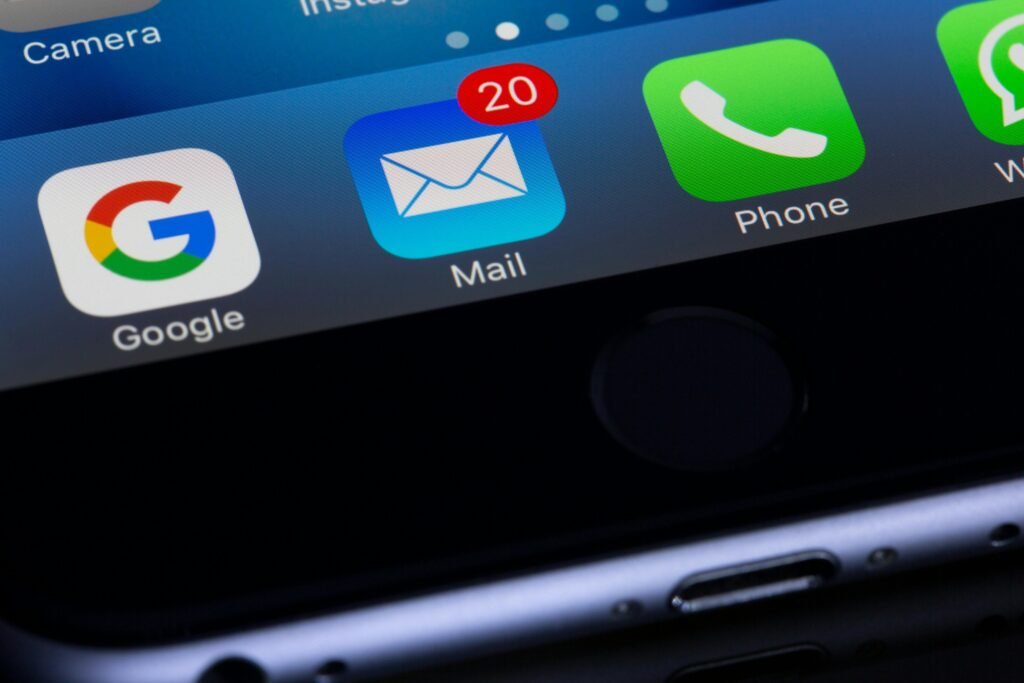 A close-up photo of a smartphone displaying Google and Mail to remind people they can buy a business or custom email address from Havesites: website design services
