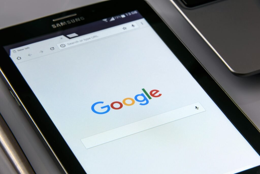 Close-up of a tablet displaying Google's search screen, emphasizing technology and internet browsing good for bussiness and for buying SEO packages from Havesites website design services