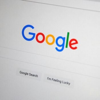 Close-up of the Google homepage on a screen showing search options. Good for Small SEO Boost BIG SEO Boost and Massive SEO Boost