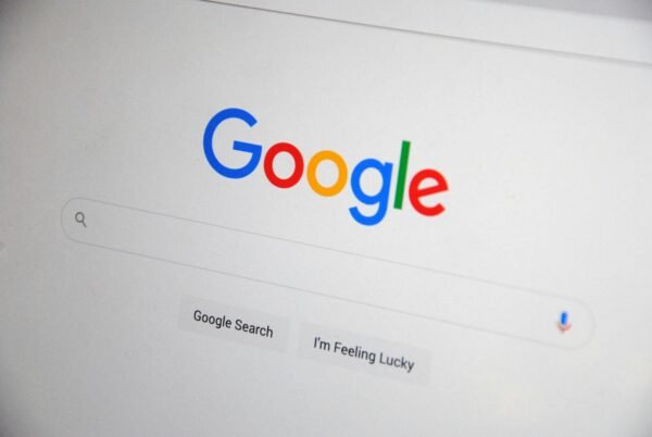 Close-up of the Google homepage on a screen showing search options. Good for Small SEO Boost BIG SEO Boost and Massive SEO Boost